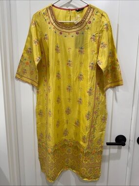 Aurelia Women's vibrant yellow embellished festive kurta top